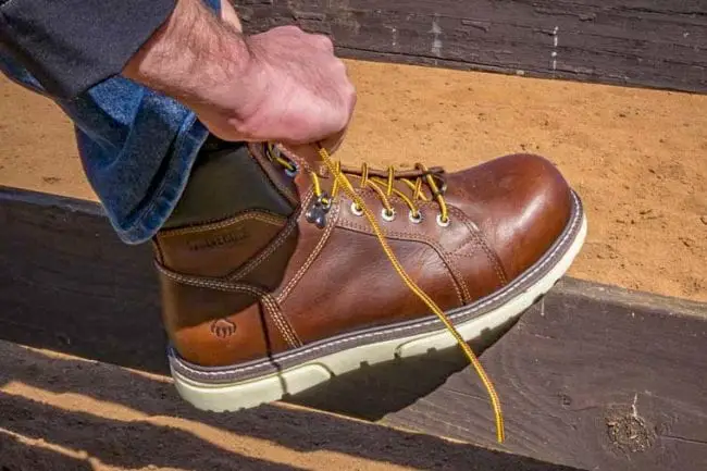 How should work boots fit