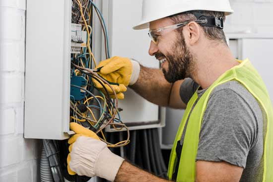 Electricians Wear Rubber Gloves While Working