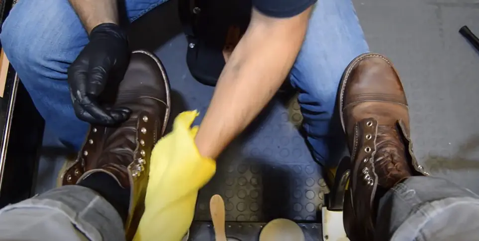 How do you remove motor oil from leather shoes