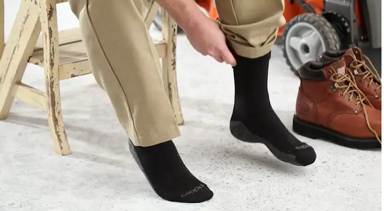 Wear moisture-wicking socks with black boots