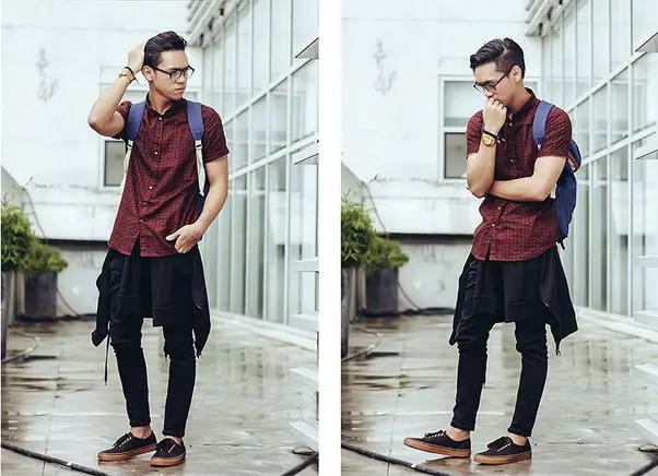 maroon shirt and black jeans
