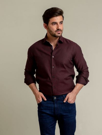 Maroon shirt with a pair of dark blue jeans