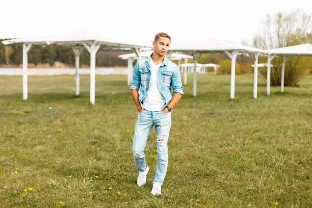Blue denim jacket, white t-shirt and light blue jeans
