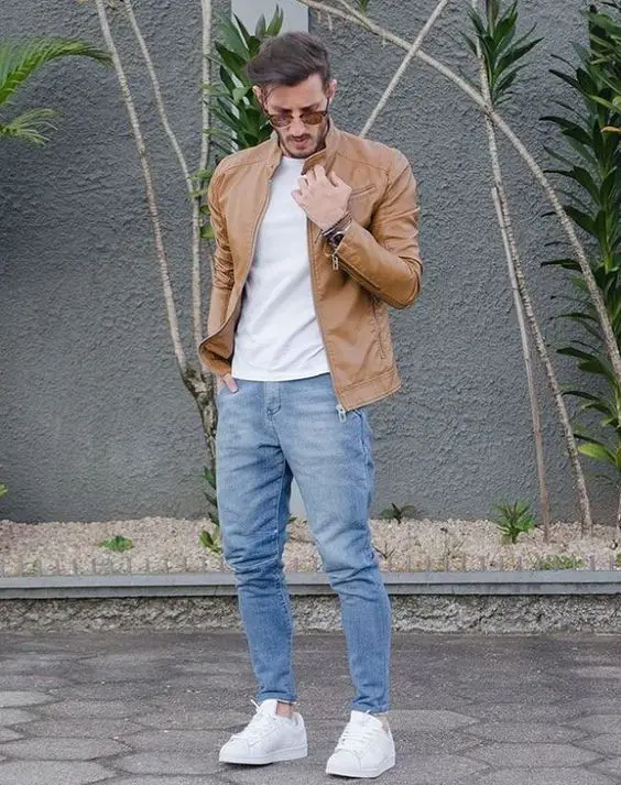 Brown leather jacket and light blue jeans