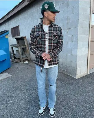 Checked green flannel shirt and light blue jeans